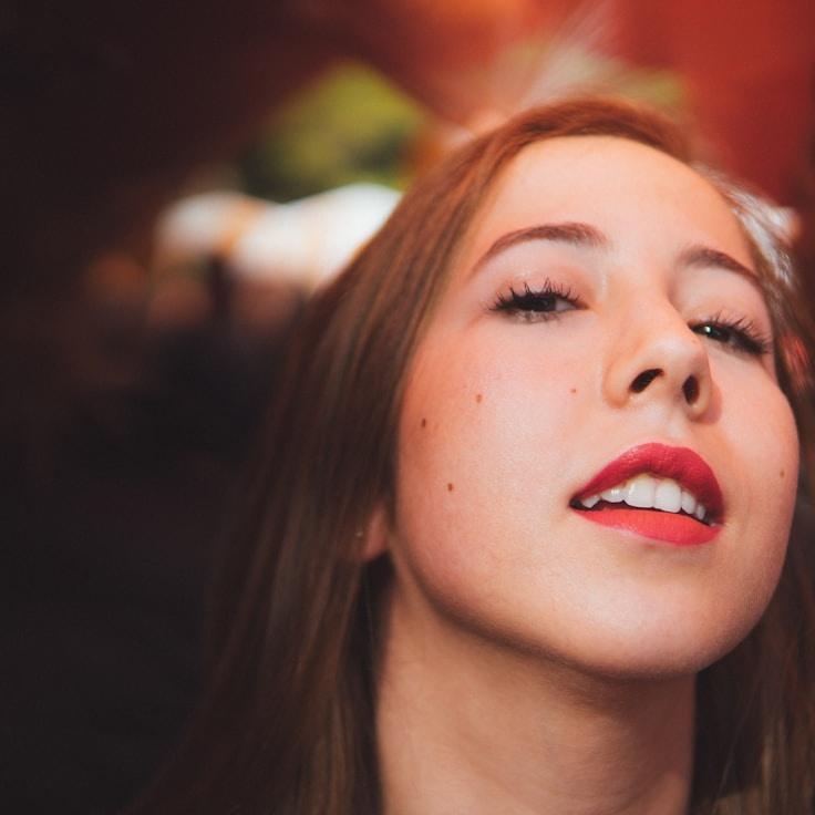 Kaveri Mehta, Lead Design Curator at SwiftPacketMove, reviewing corporate floral arrangements